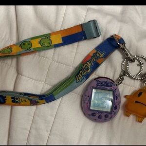 Tamagotchi connection. Comes with lanyard and little keychain.